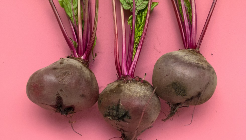 Three beets with stems attached